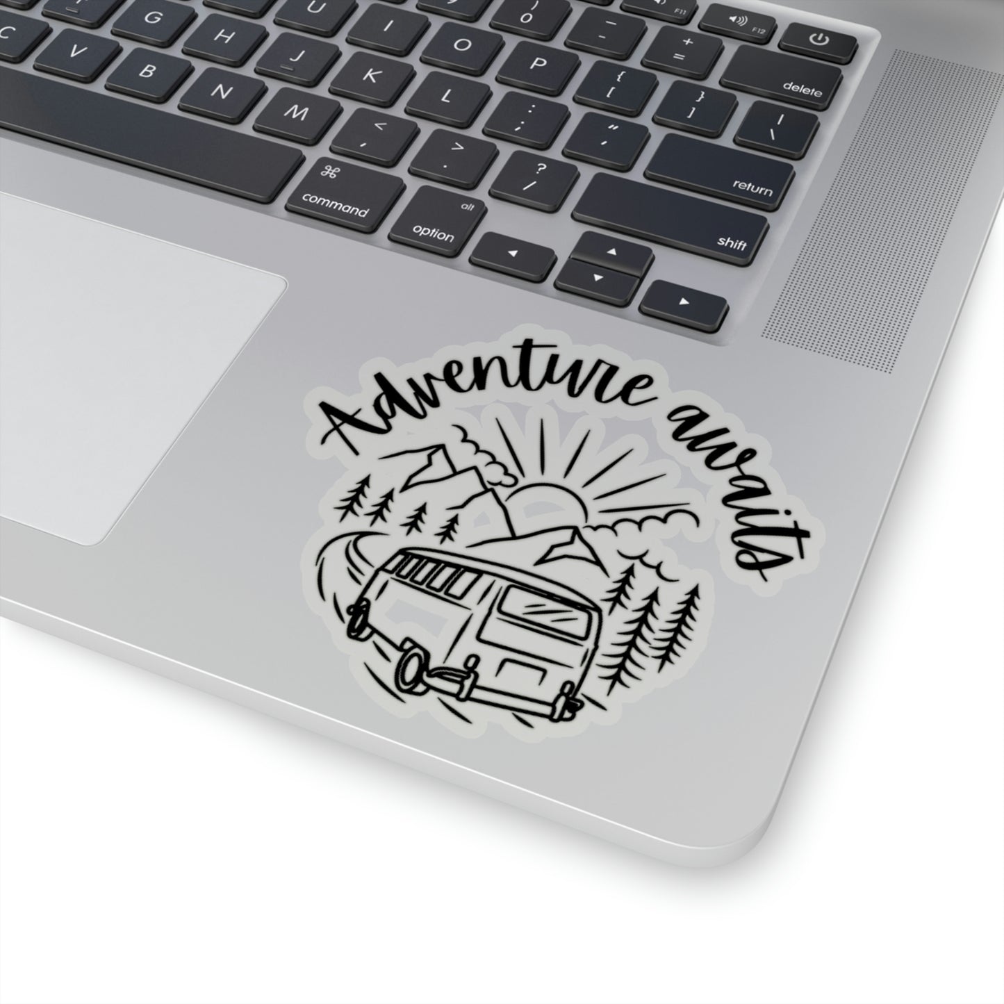 Large kiss cut sticker with transparent background, a drawinfg of a campervan and words "adventure awaits".