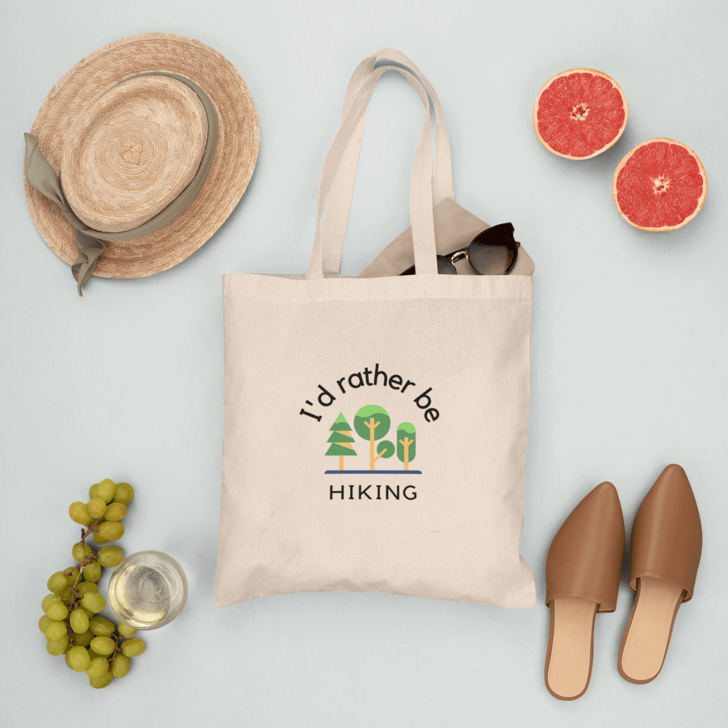 Canvas tote bag with print "I'd rather be hkiking" featuring summer season fruits.