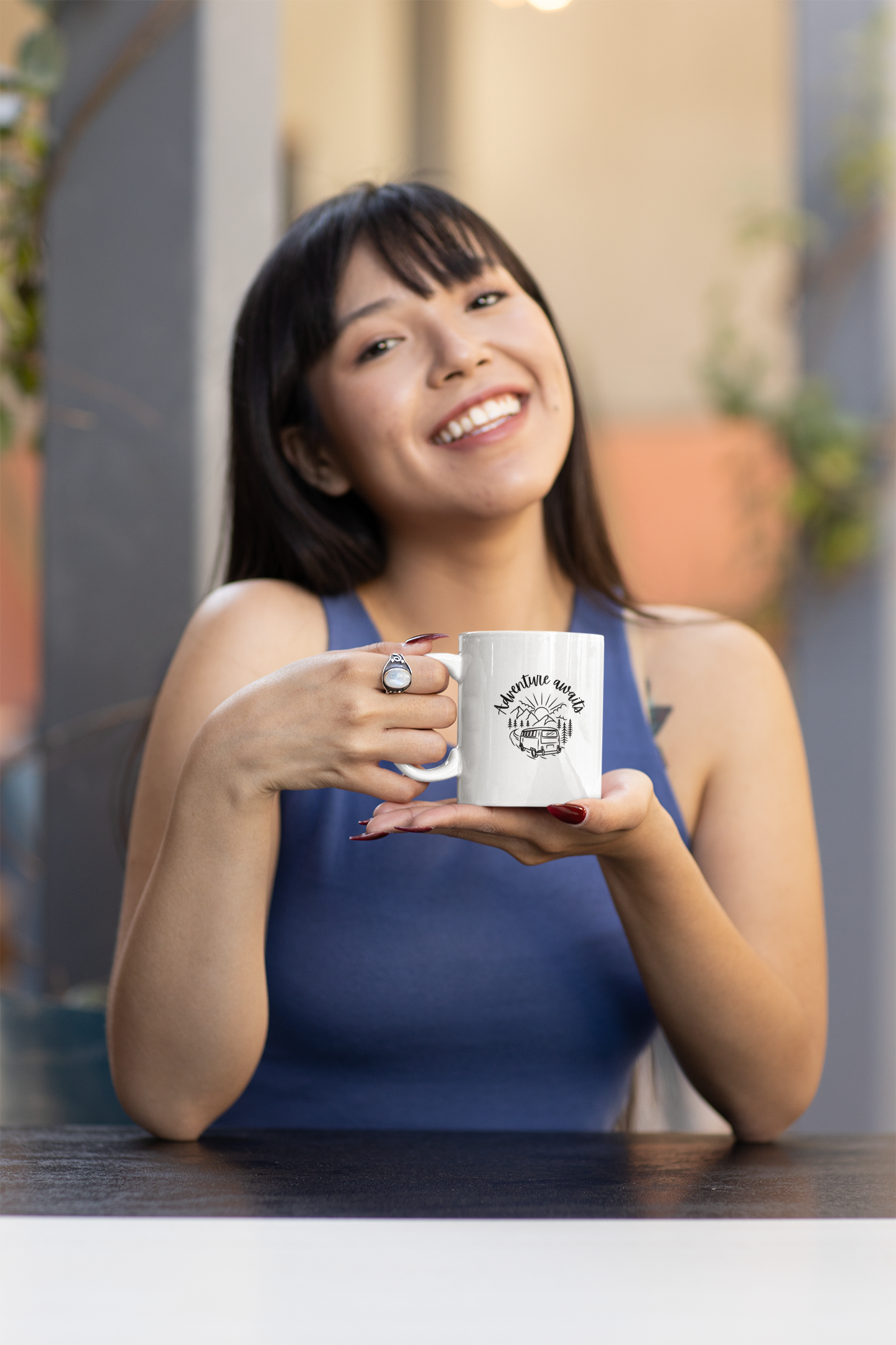 Happy woman holdgin a white ceramic coffee mug. 