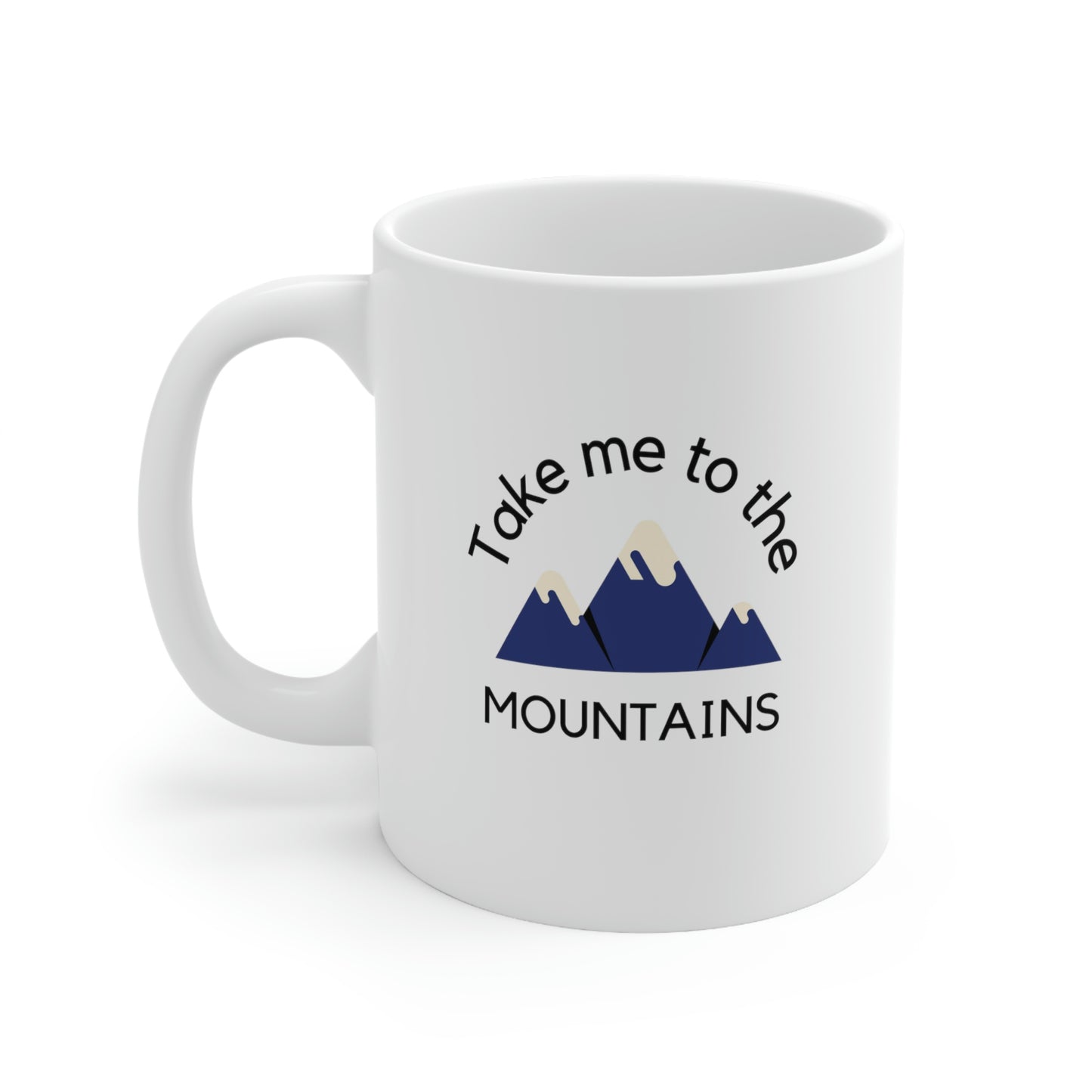 White ceramic coffee mug featuring words "take me to the mountains"
