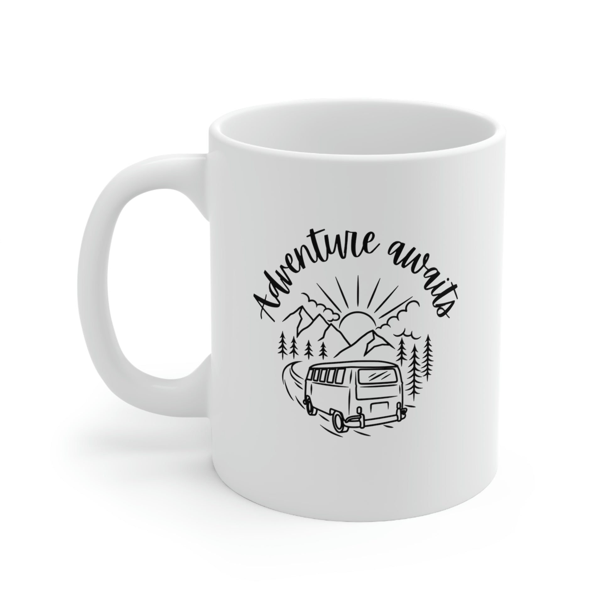 White ceramic coffee mug with a line drawing of a campervan and words "adventure awaits". 